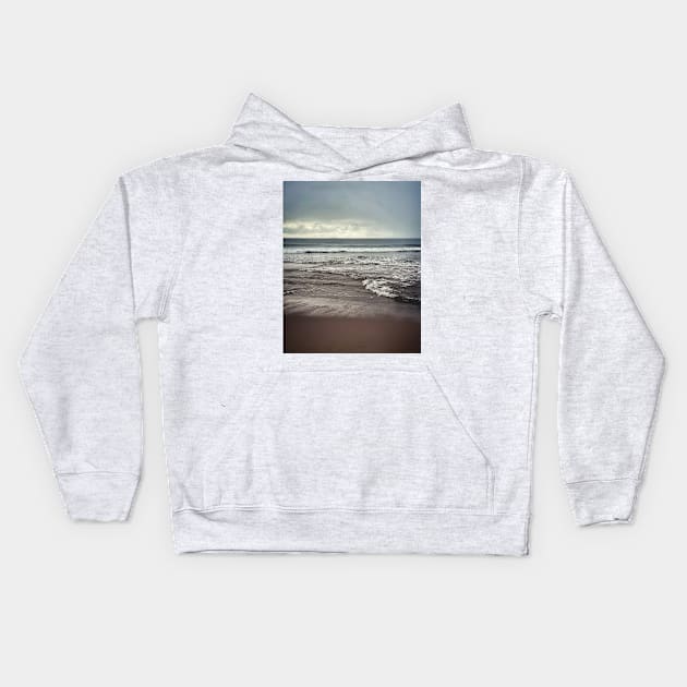 Stormy beach Kids Hoodie by goodieg